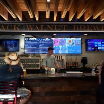 Black Walnut Brewery - a man and a woman sitting at a bar - Breweries Near Me - Leesburg, Virginia Black Walnut Brewery - a man and a woman sitting at a bar - Breweries Near Me - Leesburg, Virginia