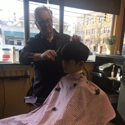 Delux Barber Shop - Classic Italian barber shop. Sinatra tunes and great haircut for $15.