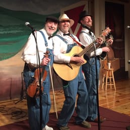 two men singing and playing instruments two men singing and playing instruments