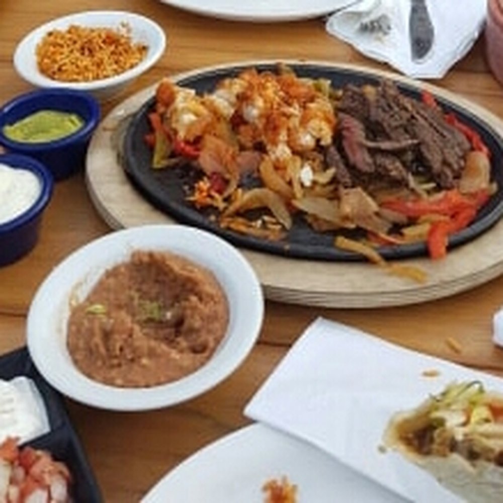 Steak and chicken for dos (2) with added refried beans and rice Just be ready to flag down your waiter for more tortillas & toppings!! Steak and chicken for dos (2) with added refried beans and rice Just be ready to flag down your waiter for more tortillas & toppings!!