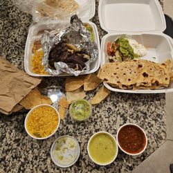 Ninfa's Mexican Restaurant - Fajitas for 1, large chicken quesadilla, side of rice, side of guacamole