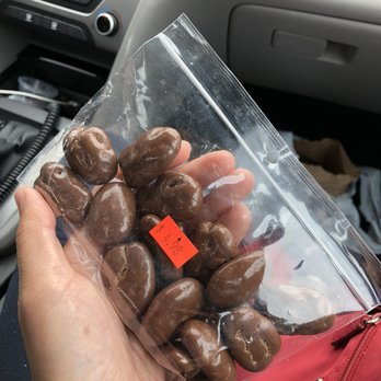 Pecan Shop - a person holding a bag of pecans - Fruits & Veggies Near Me - White, Georgia Pecan Shop - a person holding a bag of pecans - Fruits & Veggies Near Me - White, Georgia