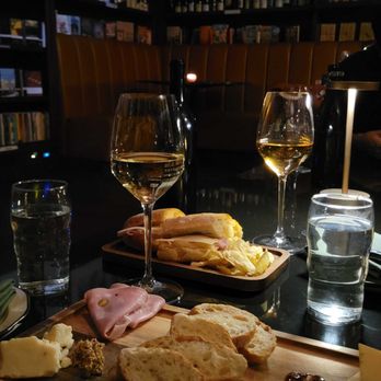 Bibliotheque - our food spread: wine, prosciutto sandwich, charcuterie board - Cafes Near Me - New York, New York