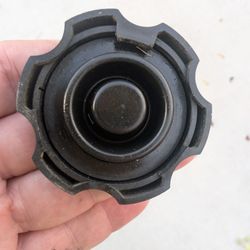 Jiffy Lube - Two of three cap clasps broken off. They were both there when this cap was replaced perhaps 10 mins earlier in the day.