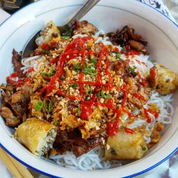 Happy Vietnam - Bún with grilled pork and fried spring rolls. Under the rice noodle there are a huge pile of salads and other veggies and herbs. Yummy. - Vietnamese Near Me - Vienna, 9 Happy Vietnam - Bún with grilled pork and fried spring rolls. Under the rice noodle there are a huge pile of salads and other veggies and herbs. Yummy. - Vietnamese Near Me - Vienna, 9