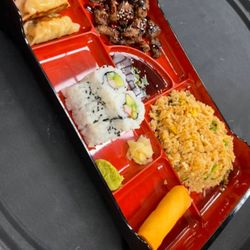 The Red Lantern Kitchen - $12.50 Lunch special Bento box, 2 pork gyoza, 1 veggie spring roll, 1 cali roll, steamed or fried rice, and choice of protein w/ teriyaki sa