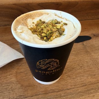 Pangolin Café - pistachio oat milk latte with housemade whipped cream - Coffee & Tea Near Me - Reno, Nevada Pangolin Café - pistachio oat milk latte with housemade whipped cream - Coffee & Tea Near Me - Reno, Nevada