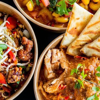Noodlebox - three bowls of food including rice, chicken, and vegetables - Asian Fusion Near Me - Regina, Saskatchewan
