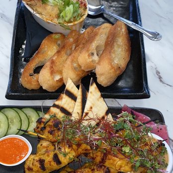 Carruthers - Chicken satay skewers and an artichoke cheese dip - New American Near Me - Astoria, Oregon Carruthers - Chicken satay skewers and an artichoke cheese dip - New American Near Me - Astoria, Oregon
