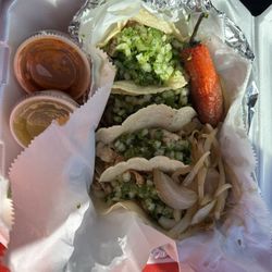 La Perla Tapatia Taqueria & Paleteria - Two chicken and two steak tacos to go.