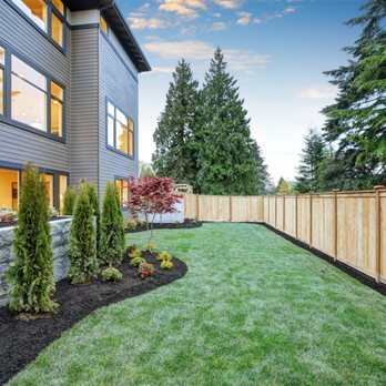 Tran's Landscaping - a backyard with a retaining wall - Landscaping Near Me Tran's Landscaping - a backyard with a retaining wall - Landscaping Near Me