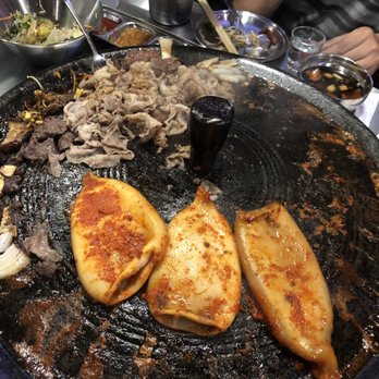 The Cast Iron Pot 3 - Spicy squid and brisket up top - Korean Near Me - Flushing, New York The Cast Iron Pot 3 - Spicy squid and brisket up top - Korean Near Me - Flushing, New York