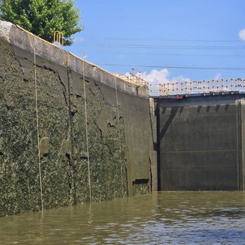 Sam Patch Tour Boat - Wall of the canal to the left with the lock ahead. - Boat Charters Near Me - Pittsford, New York Sam Patch Tour Boat - Wall of the canal to the left with the lock ahead. - Boat Charters Near Me - Pittsford, New York