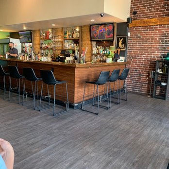 Bella Luna - a woman sitting at a bar - Italian Near Me - Merced, California Bella Luna - a woman sitting at a bar - Italian Near Me - Merced, California