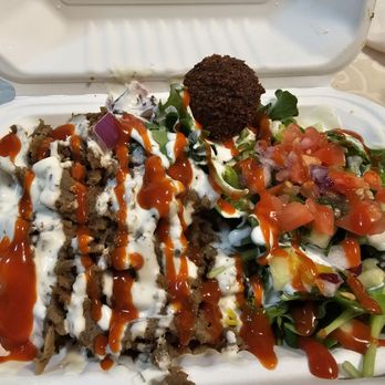 Naji Baba - Lamb plate with the hot sauce drizzled over everything and the magical lil falafel chillin. - Sandwiches Near Me - Kailua, Hawaii Naji Baba - Lamb plate with the hot sauce drizzled over everything and the magical lil falafel chillin. - Sandwiches Near Me - Kailua, Hawaii