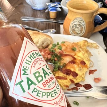 Another Broken Egg Cafe - Tabasco love! Omelette, sadly not today. In foreground pic see hubs lonely egg on plate - Breakfast & Brunch Near Me - Lafayette, Louisiana