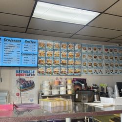 Newbury Donut - Menu at counter- includes breakfast sandwiches & other sandwiches, along with donut choices