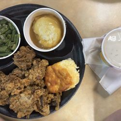 Liver dinner with green beans, mashed potatoes & gravy, biscuit, and white gravy for the livers