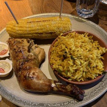 Nando's Peri-Peri - Quarter Peri-peri Chicken (Med. Hot) w/ Grilled Corn & Spicy Rice - Portuguese Near Me - Ottawa, Ontario Nando's Peri-Peri - Quarter Peri-peri Chicken (Med. Hot) w/ Grilled Corn & Spicy Rice - Portuguese Near Me - Ottawa, Ontario