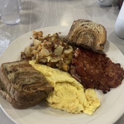 Village Restaurant - Scrambled eggs with corned beef home fries and rye toast