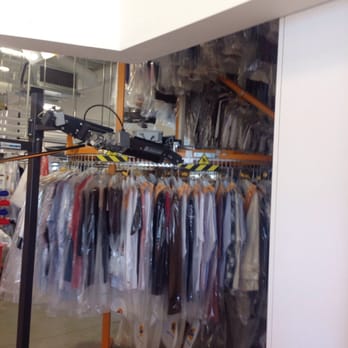 Tide Cleaners - Moving rack of clothes - Dry Cleaning Near Me - Charlotte, North Carolina