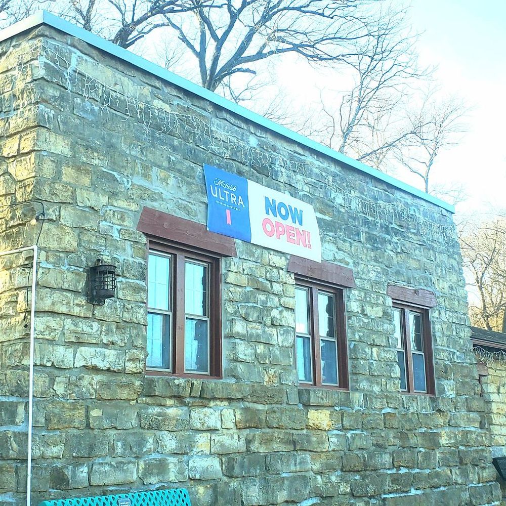 Snackle Box - a stone building with a sign on it - American Near Me - Kansas City, Kansas Snackle Box - a stone building with a sign on it - American Near Me - Kansas City, Kansas
