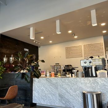 Cavo Coffee - a coffee shop counter with a coffee machine - Coffee & Tea Near Me - Houston, Texas