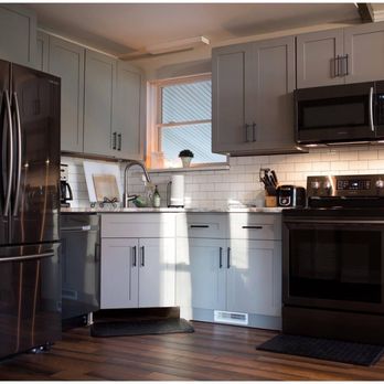 Cabinets To Go - a kitchen with stainless steel appliances - Kitchen & Bath Near Me - Richmond, Virginia