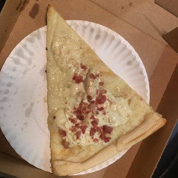 Planet Pizza - a slice of pizza on a paper plate - Pizza Near Me - Orlando, Florida Planet Pizza - a slice of pizza on a paper plate - Pizza Near Me - Orlando, Florida