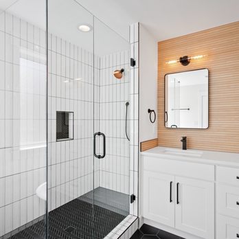 Reliable Men Construction - a bathroom with a walk in shower - Tiling Near Me - Portland , Oregon