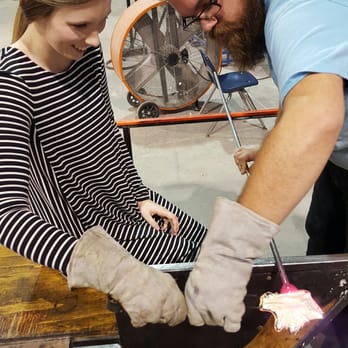 Neusole Glassworks - Pulling out the petals from the hot glass bulb. - Educational Services Near Me - Cincinnati, Ohio Neusole Glassworks - Pulling out the petals from the hot glass bulb. - Educational Services Near Me - Cincinnati, Ohio