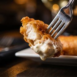 Alaskan Cod Fish & Chips Tempura battered, French fries, house-made tartar sauce & lemon