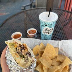 Steak burrito, chips, fruit tea