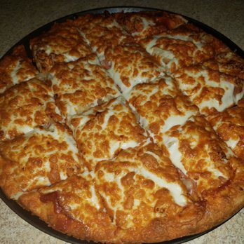 Western Pizza - a cheese pizza on a pan - Pizza Near Me - Regina, Saskatchewan