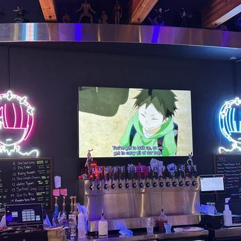 Izakaya - Main bar, with TV playing anime, flanked by Ram and Rem neon lights. - Izakaya Near Me - Beavercreek, Ohio Izakaya - Main bar, with TV playing anime, flanked by Ram and Rem neon lights. - Izakaya Near Me - Beavercreek, Ohio