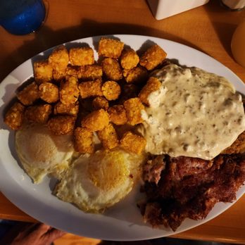 The Buttered Biscuit - The Chivken little - 2 eggs, tots, 6oz chicken fried steak, homemade corned beef hash and cornbread (not pictured) - New American Near Me - Sumner, Washington The Buttered Biscuit - The Chivken little - 2 eggs, tots, 6oz chicken fried steak, homemade corned beef hash and cornbread (not pictured) - New American Near Me - Sumner, Washington