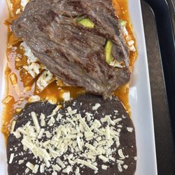 Antojitos Mexicanos La Fonda - Chilaquiles rojos with cesina.