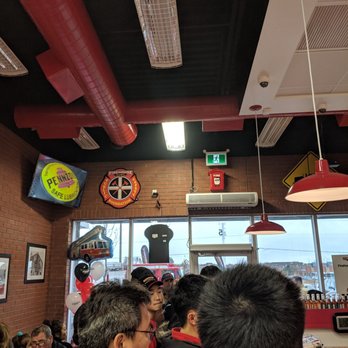 Firehouse Subs - In the lineup, looking at the main doors - Sandwiches Near Me - Markham, Ontario