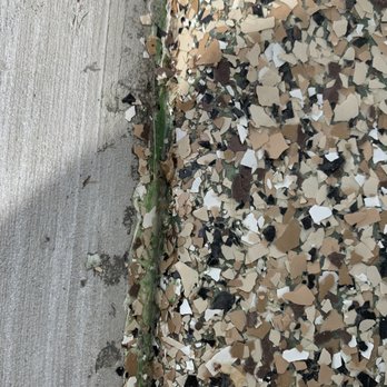 Elite Concrete Coatings - More spalling on the ramp along with epoxy spill over from the garage - Flooring Near Me - West Jordan, Utah Elite Concrete Coatings - More spalling on the ramp along with epoxy spill over from the garage - Flooring Near Me - West Jordan, Utah