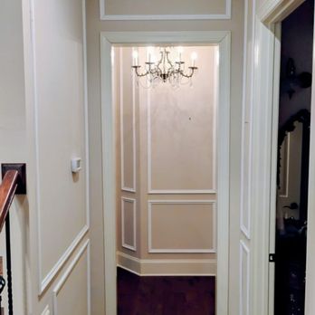 Crown Molding Experts - Custom crown molding and trim elevating a transitional hallway. - General Contractors Near Me - Youngsville, North Carolina Crown Molding Experts - Custom crown molding and trim elevating a transitional hallway. - General Contractors Near Me - Youngsville, North Carolina