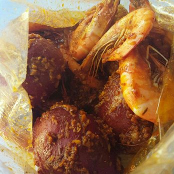 Ragin' Crawfish - Whole Shrimp Ragin special (all seasoning, hot) 3 large red potatoes and there's a corn in there somewhere. As seen its loaded with garlic! - Cajun/Creole Near Me - Oxnard, California