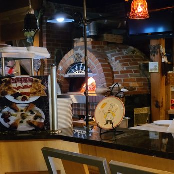Pizzeria Tivoli - a pizza oven in the background - Pizza Near Me - Saint Louis, Missouri