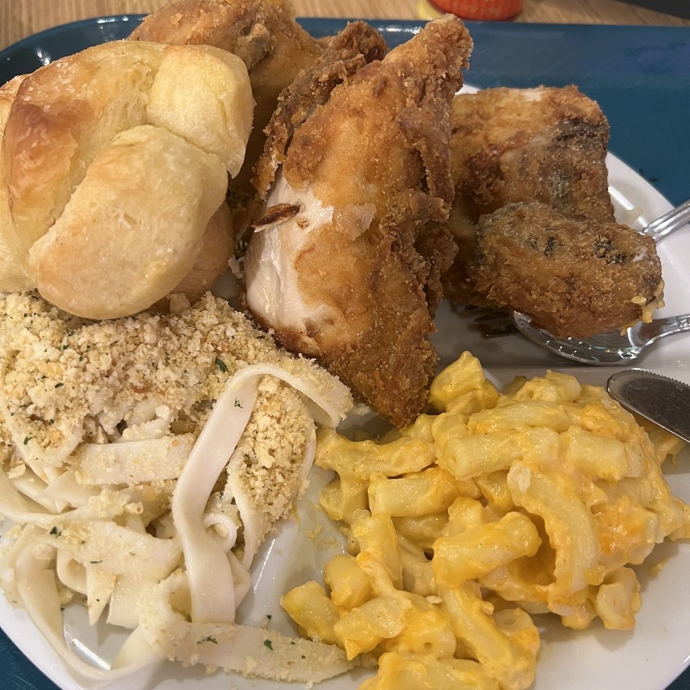 a plate of fried chicken, macaroni, and cheese a plate of fried chicken, macaroni, and cheese