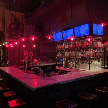 Nora Thai - a bar with neon lights and bar stools - Thai Near Me - Brooklyn, New York Nora Thai - a bar with neon lights and bar stools - Thai Near Me - Brooklyn, New York