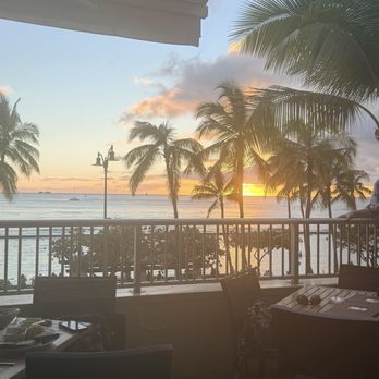 Tikis Grill & Bar - Patio sunset at 6:24 - Seafood Near Me - Honolulu, Hawaii Tikis Grill & Bar - Patio sunset at 6:24 - Seafood Near Me - Honolulu, Hawaii