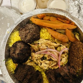 Jerusalem Cafe - Combination Plate with, beef, steak, chicken, falafel, mixed vegetables over a bed of rice pilaf, all with their own unique flavors. - Middle Eastern Near Me - Oak Park, Illinois