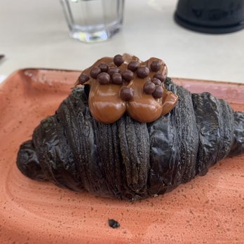 B Bistro + Bakery - Charcoal Croissant (dulce de leche filling) - Bakeries Near Me - Miami, Florida B Bistro + Bakery - Charcoal Croissant (dulce de leche filling) - Bakeries Near Me - Miami, Florida