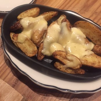 Wicked Sisters - Sinfully delicious Raclette potatoes! Definitely something to share! - American Near Me - Baltimore, Maryland Wicked Sisters - Sinfully delicious Raclette potatoes! Definitely something to share! - American Near Me - Baltimore, Maryland