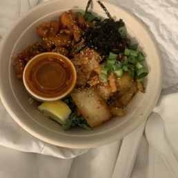 Hot chicken with kimchi, extra green onion, seasoned seaweed and sesame seeds.