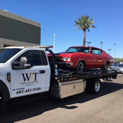 Flat Bed Towing - At Westgate Towing we run a local family-owned business that is excited to serve people in our community. Westgate Towing offers reasonable prices on all towing services. No matter what time is it in the day or night, we are at your service. Flat Bed Towing - At Westgate Towing we run a local family-owned business that is excited to serve people in our community. Westgate Towing offers reasonable prices on all towing services. No matter what time is it in the day or night, we are at your service.